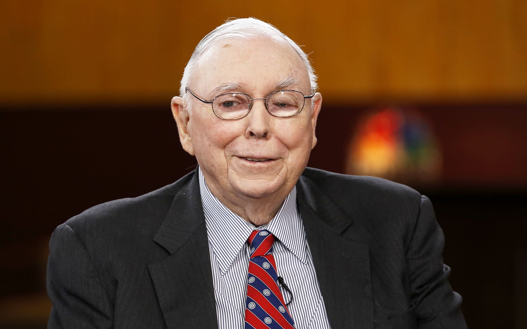 A photo of Berkshire Hathway’s Vice Chairman, Charlie Munger, captured with a smile.
Image Source: CNBC