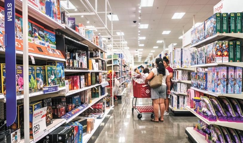 Two women are consuming in supermarket which shows high demand on products and this causes high inflation